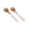Set of two wooden salad servers with natural finish on a white background