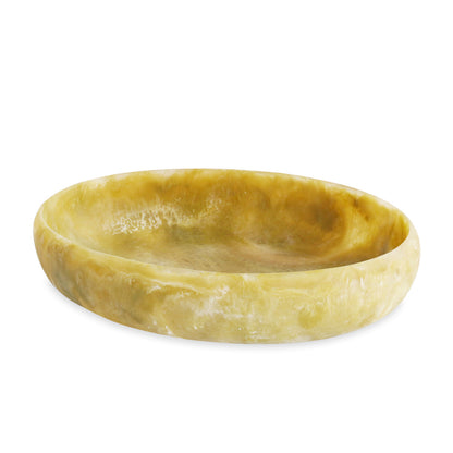 Round yellow resin bowl on a white background